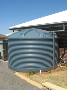 13,600L Water tank beside house