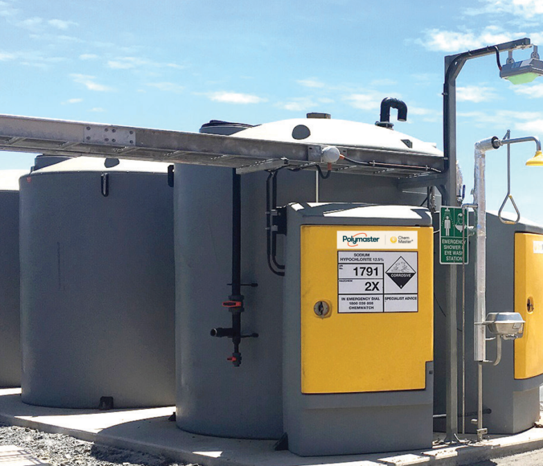 A water treatment plant with a yellow and black tank.