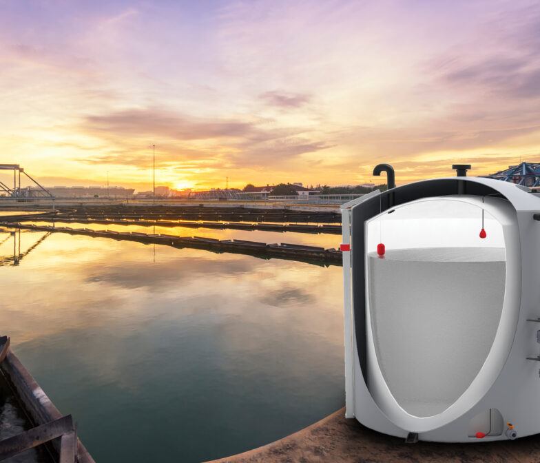 A water heater in front of a bridge.