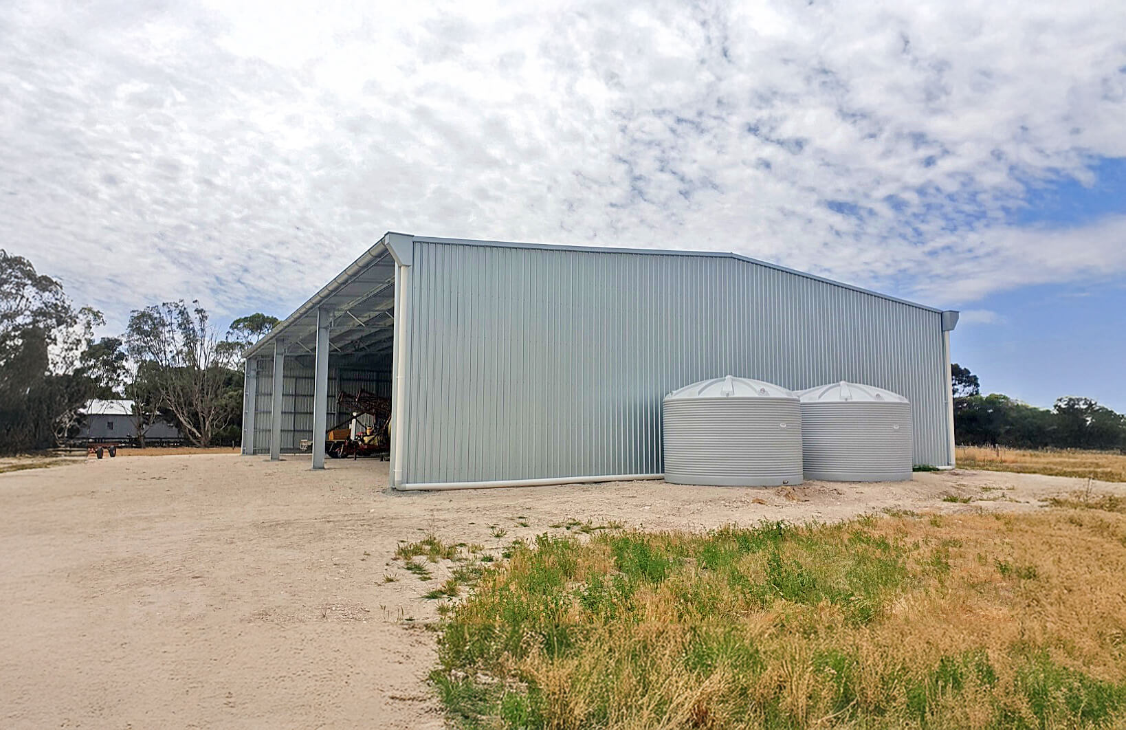 Polymaster tank installed beside a shed