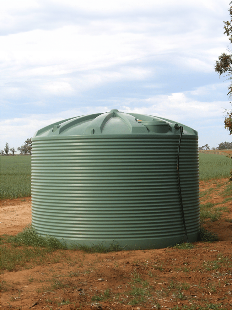 20000L Green Water Tank on a field
