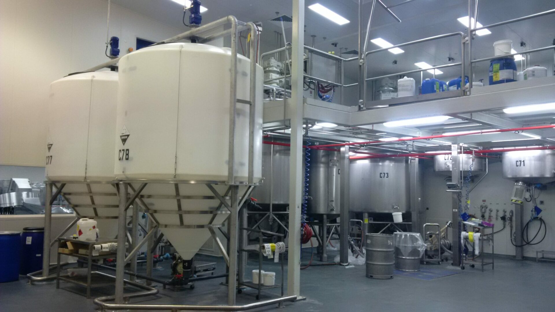 Cone Bottom tanks inside a factory space