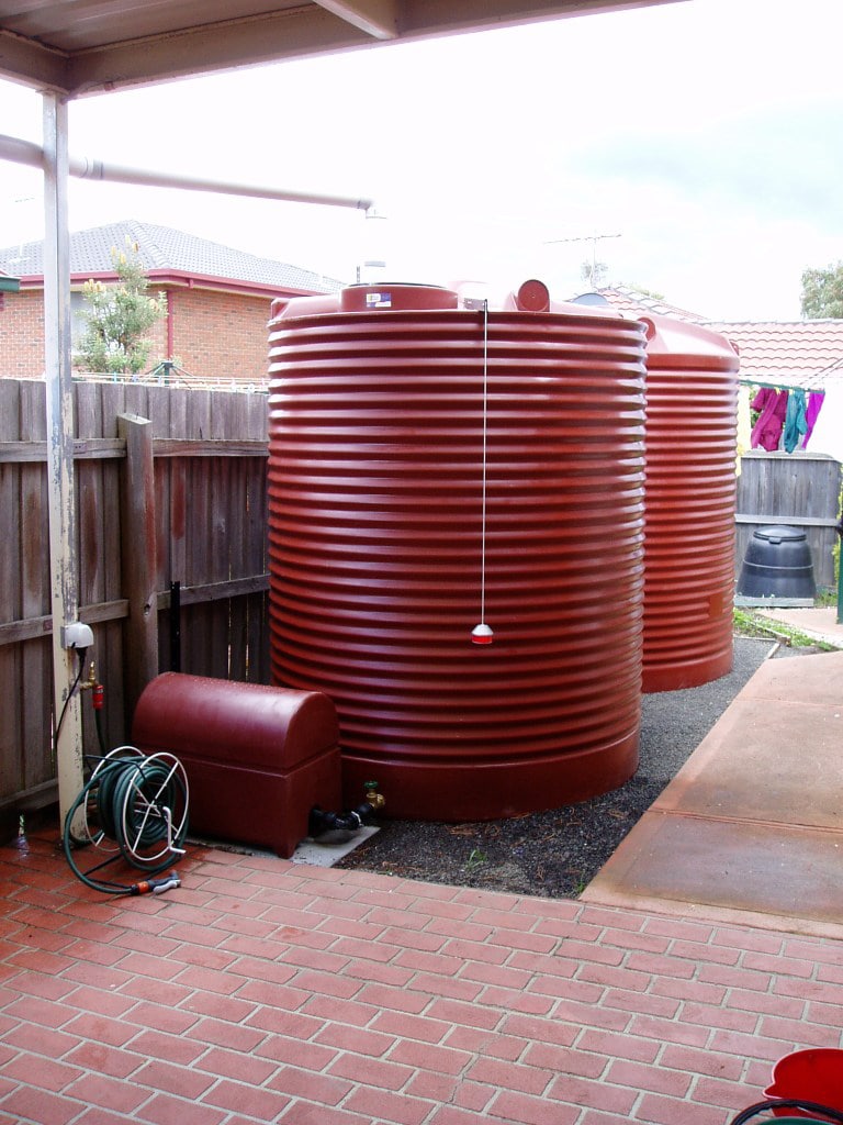 Red Polymaster water tanks installed in a residential home