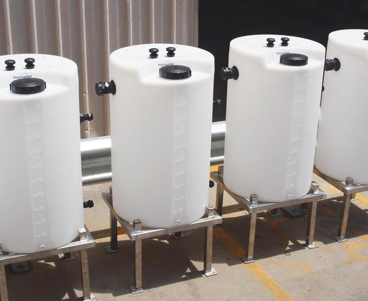 white chemical dosing tanks