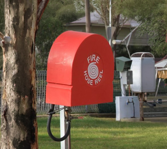 Fire hose reel cover on pole